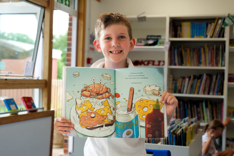 Y3 Child Showing Book