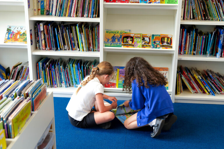 Y3 Girls Finding Books in Library